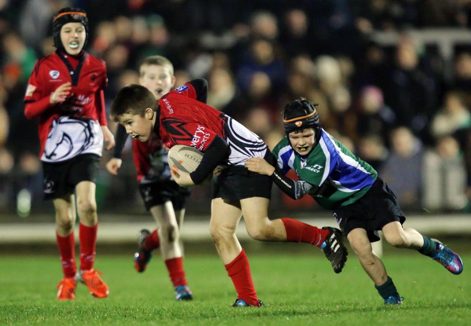 Thomas Kean breaks through the Oughterard tackle as Cian Quinn & Adam Killeen look on.